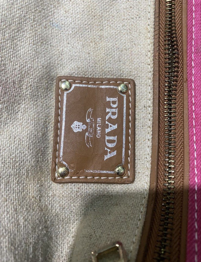 Prada Pink Canvas Tote Bag (Category: Luxury Bags & Wallets) located in Manila. Submitted by fierceocean-aca2 (Listing ID 1450762193, Image 3). Description: Authentic Prada tote bag. Pink canvas with white stitching. Large main compartment. Interior has a zippered pocket and a smaller slip pocket. Leather trim and handles. Great for everyday use or travel. Plenty of space inside..