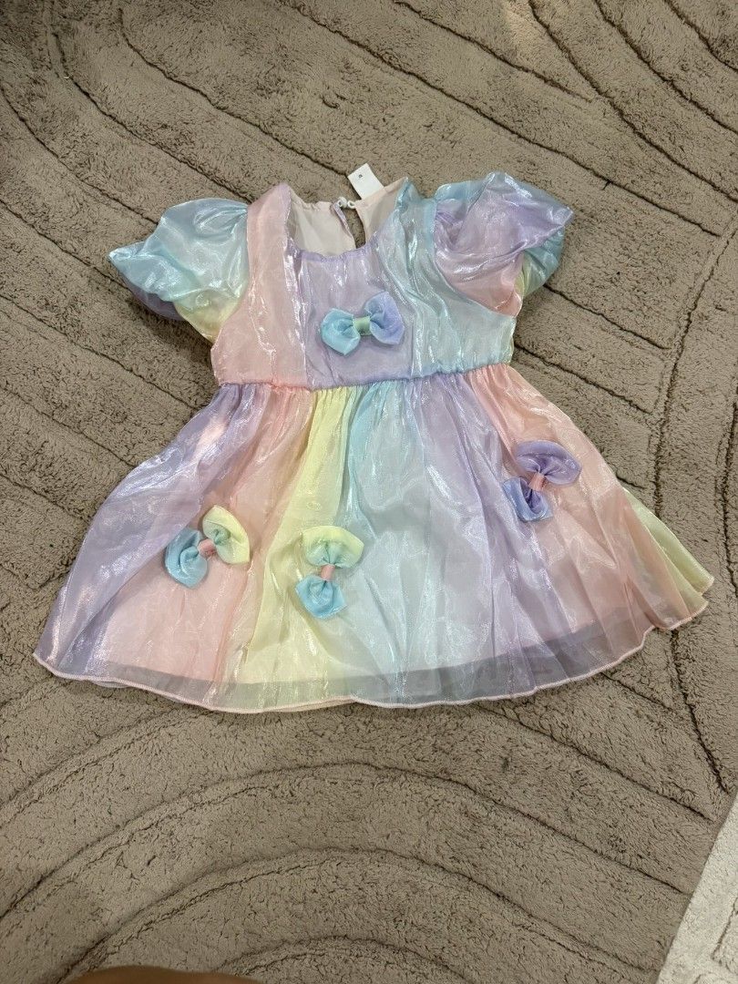 Rainbow Puff Sleeve Dress with Bows (Category: Babies & Kids Fashion) located in Manila. Submitted by cettipreloved (Listing ID 1450756077, Image 1). Description: 9-12m once lang nagamit for monthly milestone .