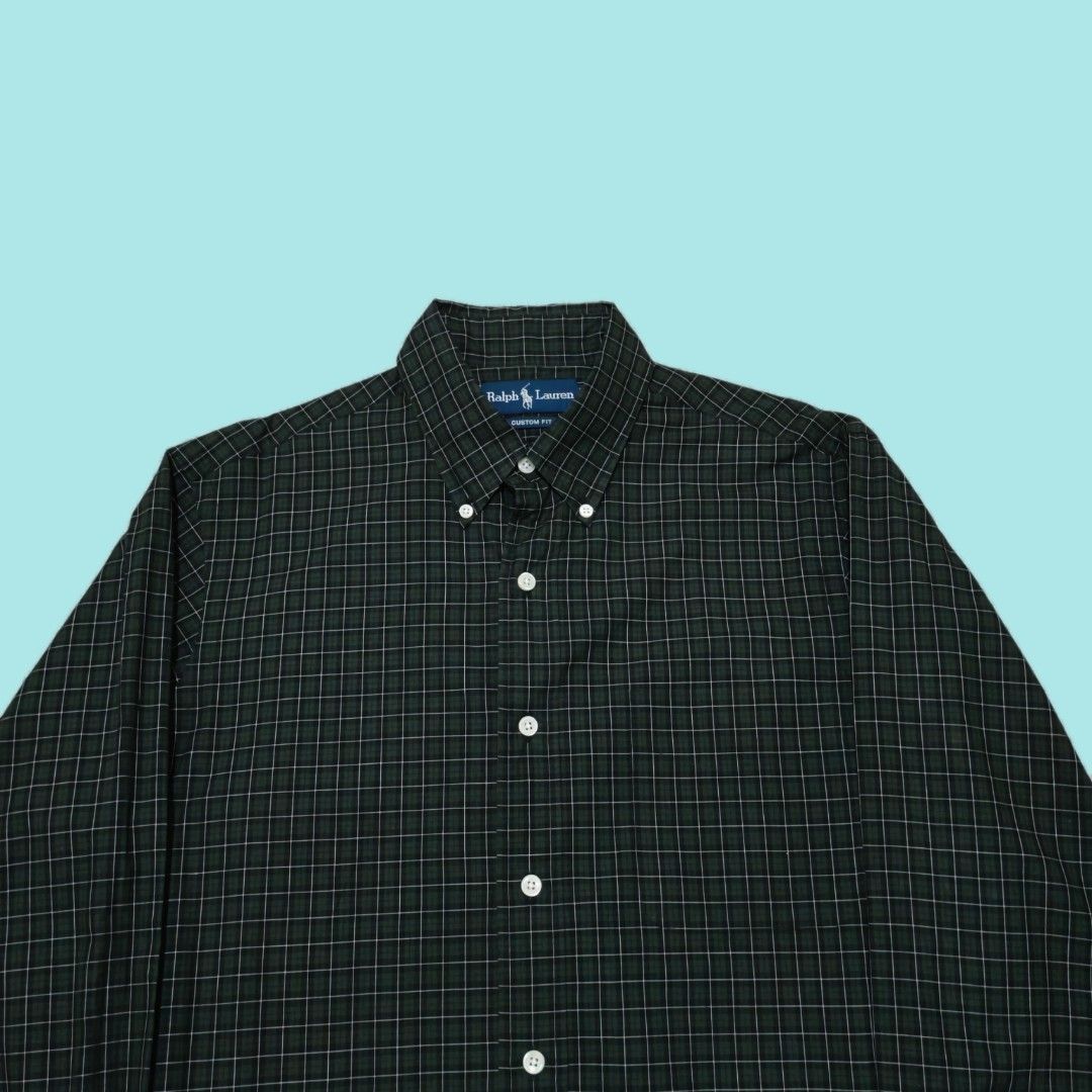 Ralph Lauren Custom Fit Plaid Button Down Shirt (Category: Tshirts & Polo Shirts ) located in Tarlac. Submitted by senkustuff (Listing ID 1450767465, Image 2). Description: - Ralph Lauren Button Down Shirt - Color: Dark Green Plaid with White Lines - Fit: Custom Fit - Size: Medium (M) - Features: Button Collar, Button Cuffs - Style: Versatile for Casual or Smart Casual Wear Dimes Length:31 Width :22 Shoulder:18 Sleeves:26 📌Color may due to light
