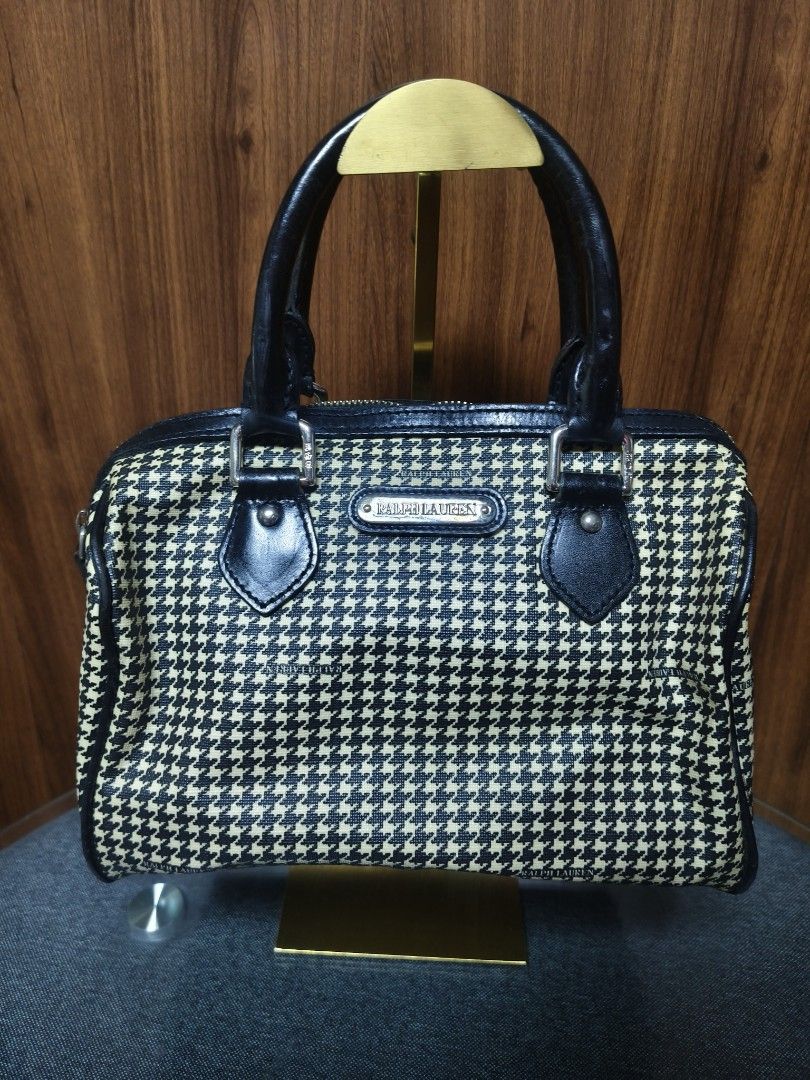 Ralph Lauren Vintage Houndstooth Boston Bag (Category: Luxury Bags & Wallets) located in Baguio. Submitted by PreiLoveMaria (Listing ID 1450857577, Image 2). Description: Vintage Ralph Lauren Houndstooth Boston Bag Featuring an iconic black-and-white houndstooth pattern with black leather trim, this piece serves major classic prep elegance. ​🖤 DEETS & FEATURES: ​Brand: Ralph Lauren ​Material: Coated Canvas body with genuine leather handles and t