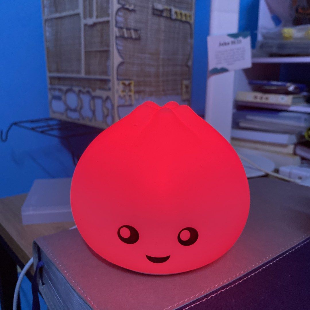 Rechargeable Bao Bun LED Night Light Lamp (Category: Lighting) located in Manila. Submitted by alleyyagap62021 (Listing ID 1450833001, Image 3). Description: - Adorable bao bun shaped night light - Made of soft, squishy silicone - Changes to multiple colors - Battery operated for easy placement - Perfect for children's rooms, desks, or as a gift - Creates a cozy and warm ambiance - rechargeable (type c).