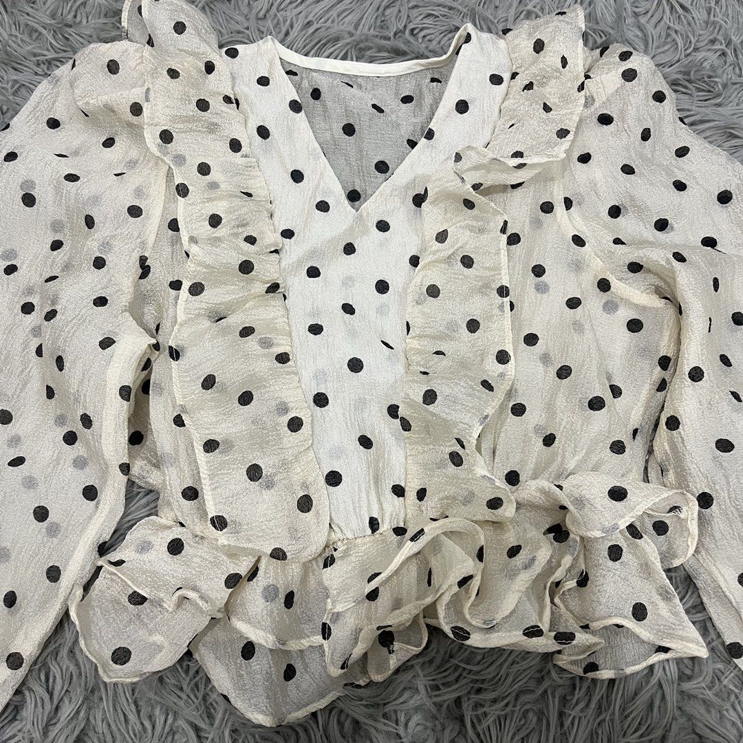 Sheer Polka Dot Ruffle V-Neck Long Sleeve Blouse (Category: Blouses) located in Rizal. Submitted by best.dressedx (Listing ID 1450903706, Image 3). Description: 🤍 ~ long sleeves with ruffled cuffs, ruffle details on front and hem, elasticated waist for a flattering fit, lightweight and flowy material, versatile for dressing up or down 🤍 ~ see-through 🤍 ~ fits xs-m (check photos for ww) 🤍 ~ delivery via j&t.