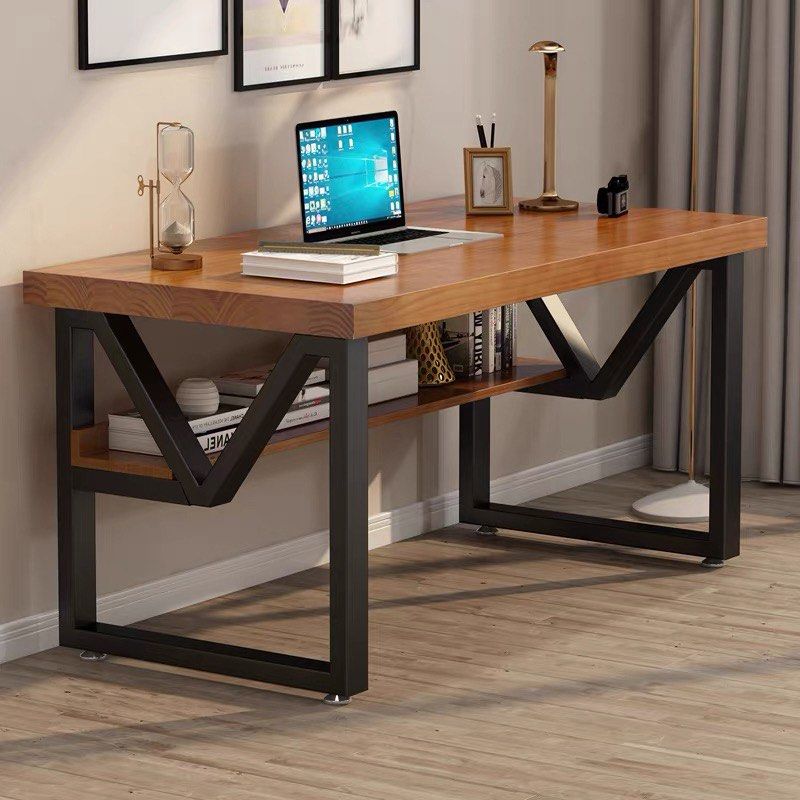 Solid wood work/study desk (Category: Tables & Sets) located in Singapore. Submitted by rehomingmystuff (Listing ID 1450879408, Image 1). Description: - Solid dark brown wood desktop (color of wooden table top in first photo is not accurate, see third photo!) - Sturdy black metal frame - Built-in storage shelf - Dimensions: 140cm (L) x 70cm (W) x 75cm (H), 5cm Thick Bought in 2024, in good condition .