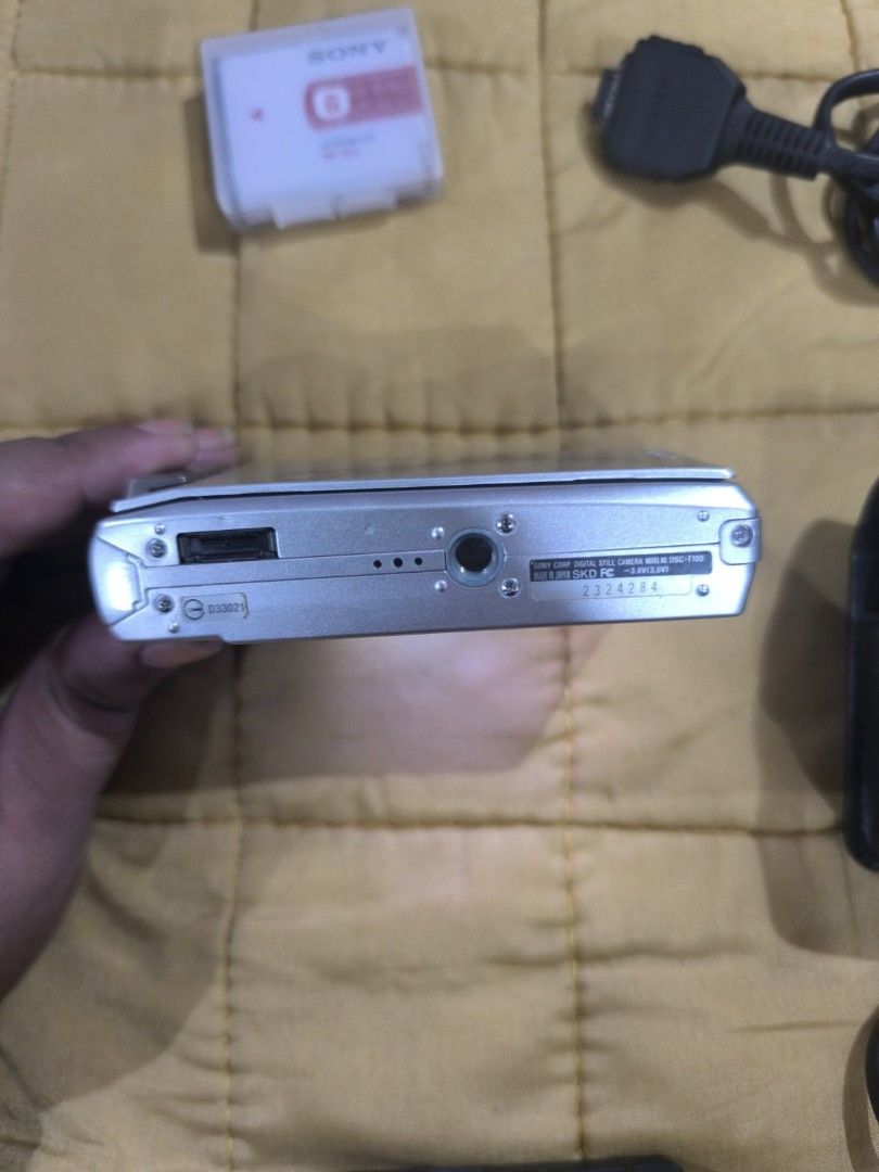 Sony Cyber-shot DSC-T70 Digital Camera with Accessories (Category: Cameras) located in Manila. Submitted by matchpoint (Listing ID 1450900939, Image 3). Description: PRELOVED AND LIGHTLY-USED ALL ORIGINAL SOLD IN ONE SET - Silver Sony Cyber-shot DSC-T70 digital camera - Includes original case, charger, and 2 pieces of battery, connector - Comes with a SONY mini tripod - Tested and working perfectly RFS: decluttering.