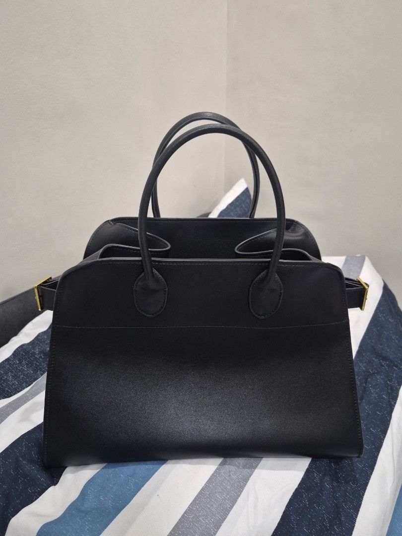 The Row Margaux 15 (Category: Luxury Bags & Wallets) located in Quezon City. Submitted by trachenburg (Listing ID 1450906256, Image 2). Description: The Row Margaux 15 - Black Masoni Leather - Size 15 - Clean interior - No flaws - with The Row Dustbag.