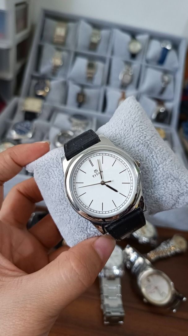Titan White Dial Watch with Black Leather Strap (original) (Category: Women's Watches) located in General Trias. Submitted by aconlineph (Listing ID 1450793598, Image 1). Description: - Classic Titan watch - Clean white dial with minimalist hour markers - Black leather strap - Simple and elegant design - Great for everyday wear or dressing up.