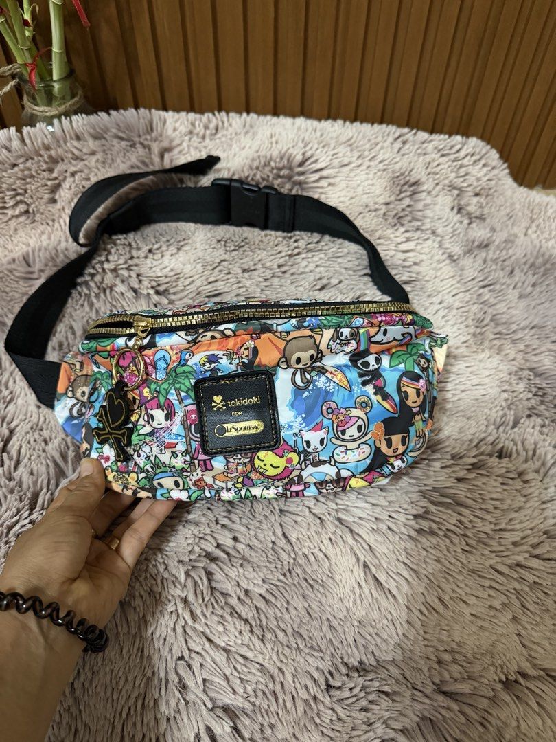 Tokidoki Fanny Pack Belt Bag (Category: Cross-body Bags) located in Danao, Cebu. Submitted by anne_2016143 (Listing ID 1450808144, Image 1). Description: - Adorable Tokidoki fanny pack - Vibrant, character-filled print - Main zippered compartment - Smaller front zip pocket - Bright pink interior lining - Adjustable black strap with buckle closure - Ideal for carrying essentials hands-free.
