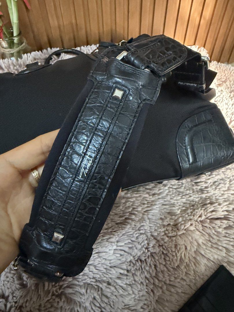 Tumi Black Nylon Crocodile Trim Weekender Bag (Category: Luxury Bags & Wallets) located in Danao, Cebu. Submitted by anne_2016143 (Listing ID 1450818407, Image 2). Description: - Genuine Black Tumi Bag - Elegant Crocodile Trim Details - Comfortable Top Handles - Detachable Shoulder Strap for Versatility - Ample Interior Space for Essentials - Perfect for Travel or Everyday Use - Smoothly Functioning Zippers - Minor signs of wear on leather trim a