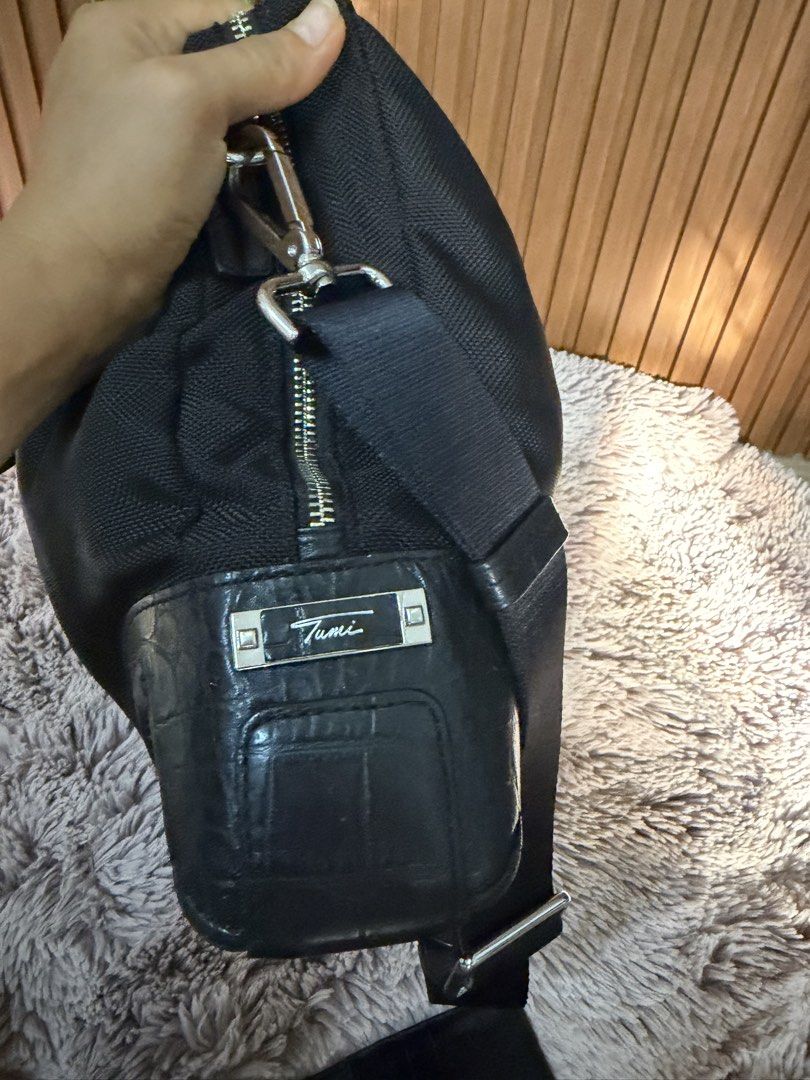 Tumi Black Nylon Crocodile Trim Weekender Bag (Category: Luxury Bags & Wallets) located in Danao, Cebu. Submitted by anne_2016143 (Listing ID 1450818407, Image 3). Description: - Genuine Black Tumi Bag - Elegant Crocodile Trim Details - Comfortable Top Handles - Detachable Shoulder Strap for Versatility - Ample Interior Space for Essentials - Perfect for Travel or Everyday Use - Smoothly Functioning Zippers - Minor signs of wear on leather trim a