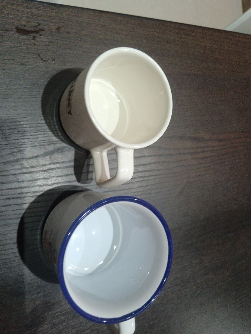 Two Ceramic Mugs - One White, One Blue Rim