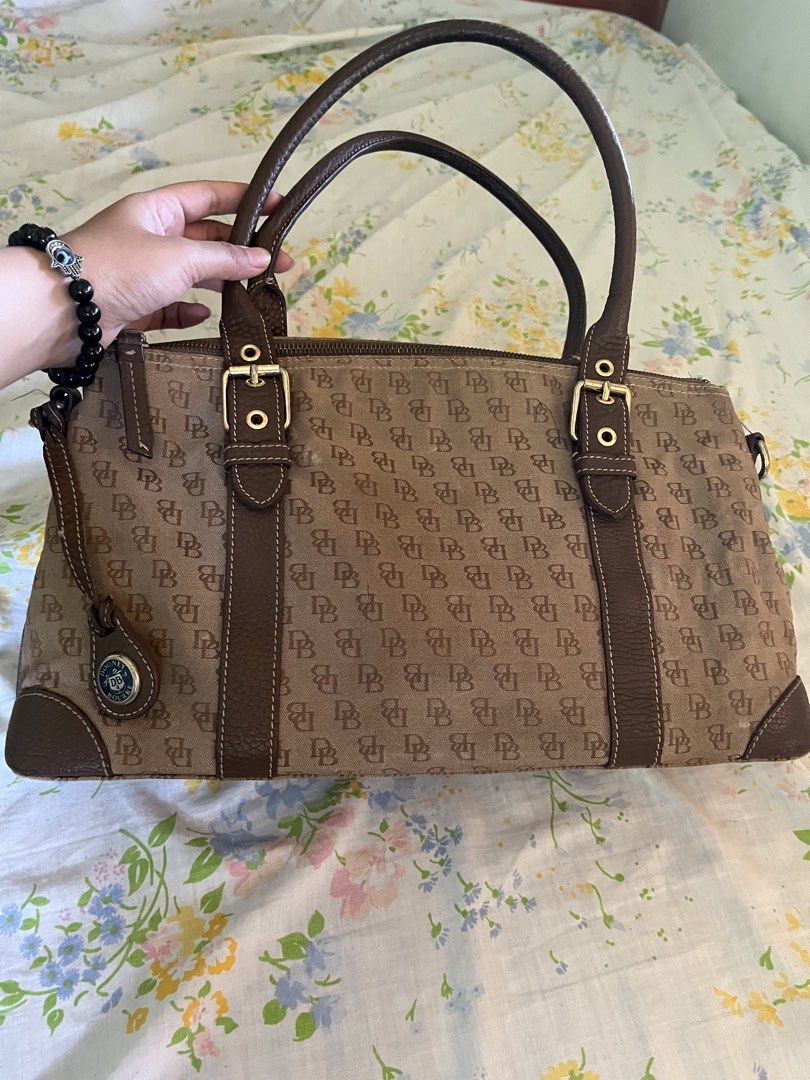 Vintage Dooney & Bourke Canvas SatchelBag (Category: Luxury Bags & Wallets) located in Vintar. Submitted by layla.ly (Listing ID 1450745481, Image 1). Description: RFS: NEED FUNDS - Classic Dooney & Bourke satchel bag - No major issue, just some white spots on the second picture MOP: GCASH/GOTYME MOD: JNT Shipping fee will be shouldered by the buyer .
