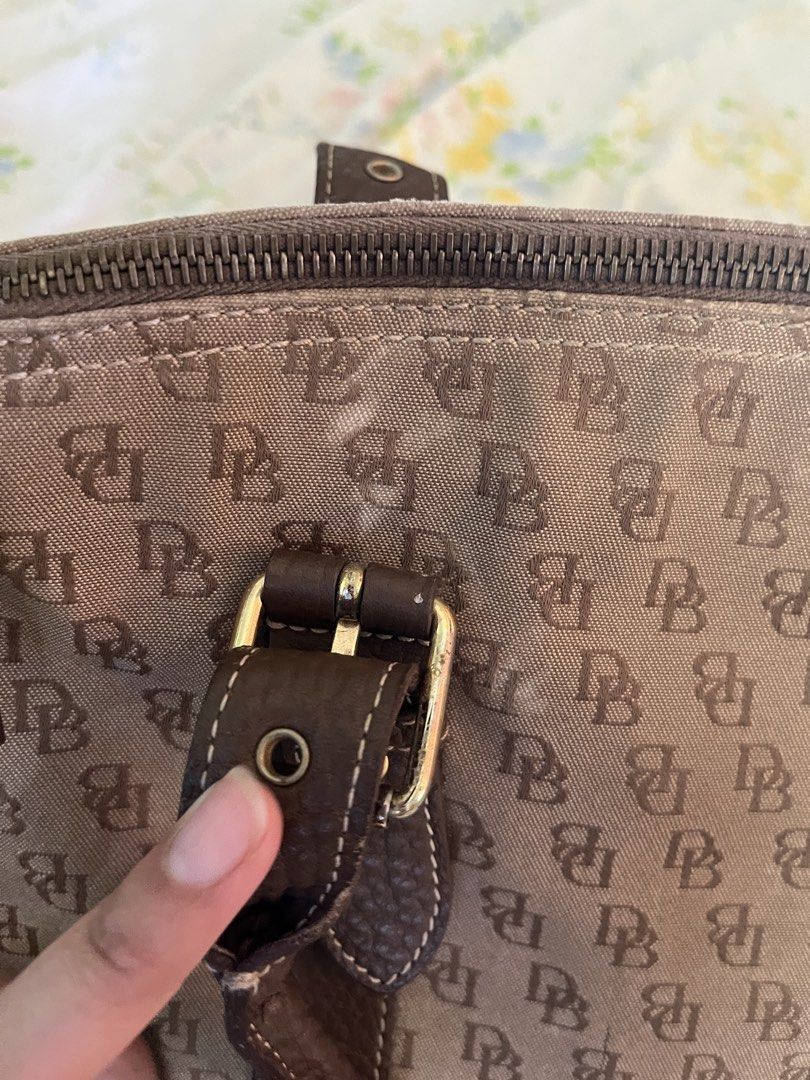 Vintage Dooney & Bourke Canvas SatchelBag (Category: Luxury Bags & Wallets) located in Vintar. Submitted by layla.ly (Listing ID 1450745481, Image 2). Description: RFS: NEED FUNDS - Classic Dooney & Bourke satchel bag - No major issue, just some white spots on the second picture MOP: GCASH/GOTYME MOD: JNT Shipping fee will be shouldered by the buyer .
