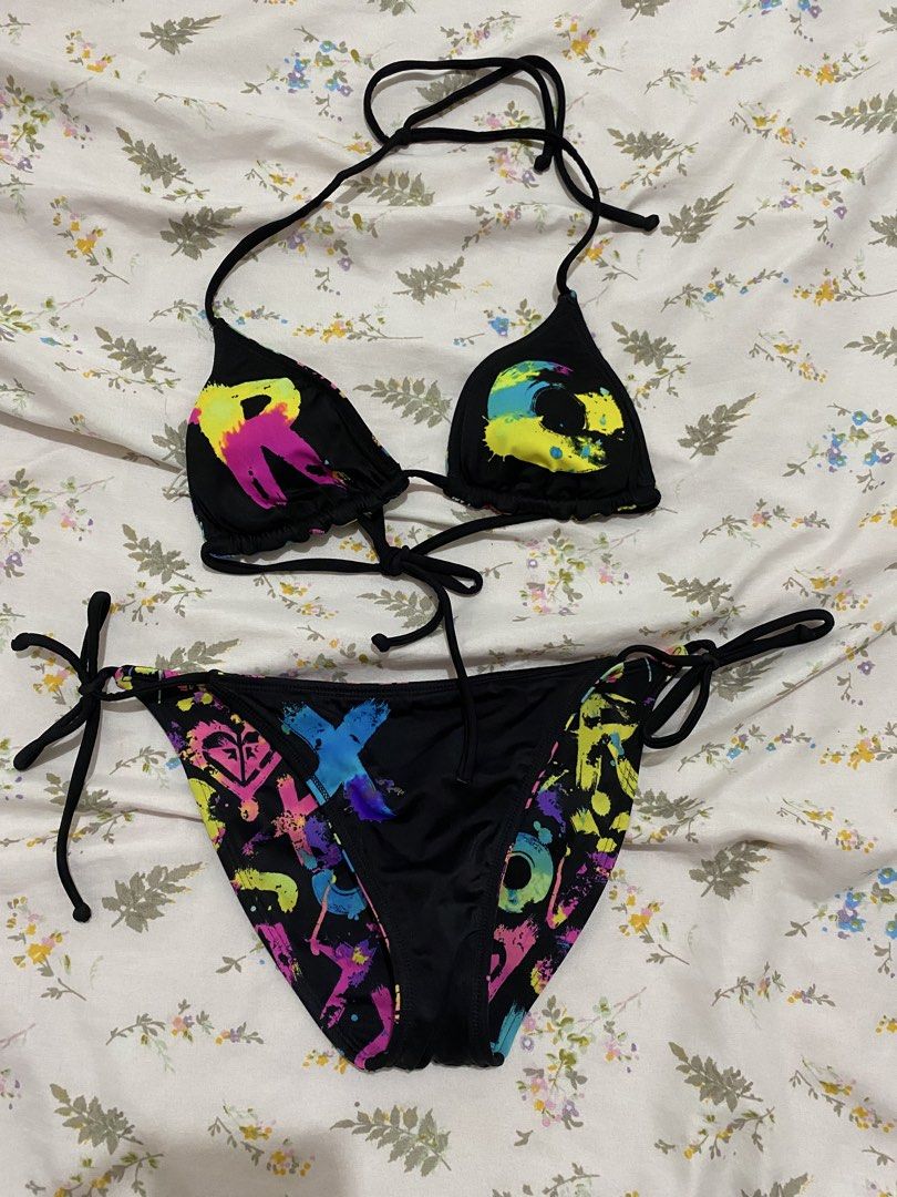 Vintage ROXY "Out Loud" Neon Graffiti Reversible Bikini Set (Category: Bikinis & Swimsuits) located in Marilao. Submitted by kyssmarila (Listing ID 1450871922, Image 3). Description: — Size: XS • “R” and “O”: Placed individually onto each triangle cup of the bra top. • “X”: Centered boldly right across the front panel of the bikini bottom. • “Y”: Printed on the reverse back panel of the bottom to complete R-O-X-Y. early 2000s surf-babe look with 