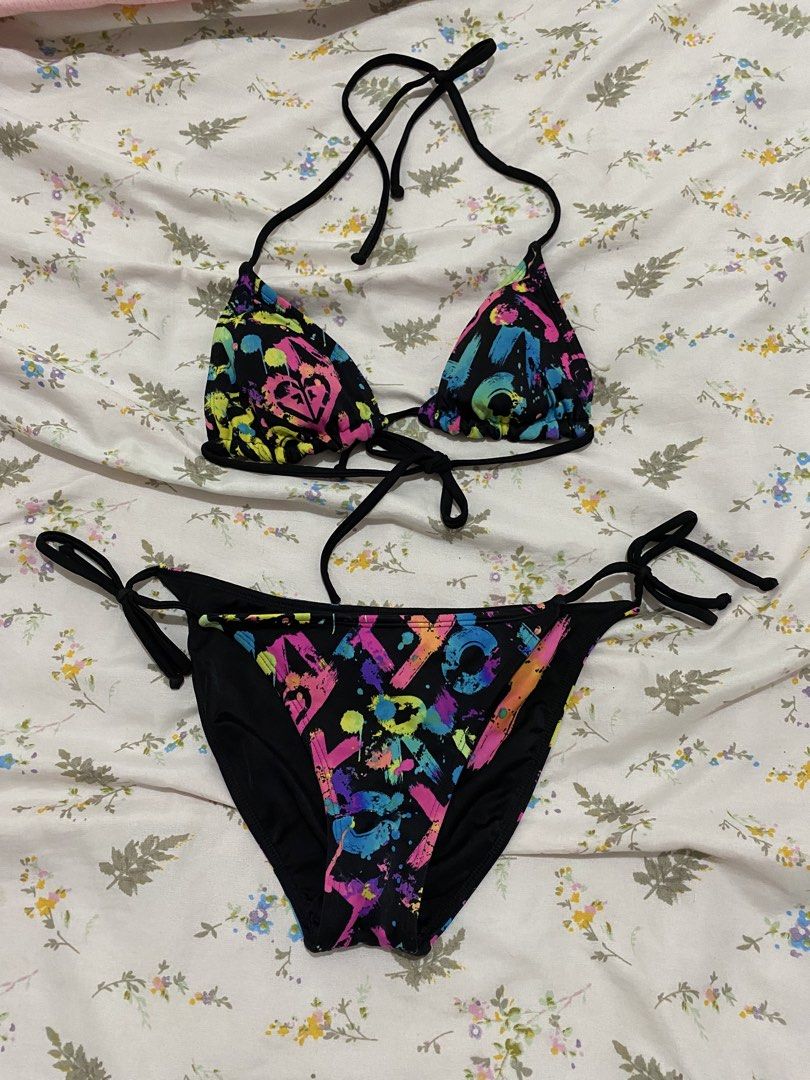 Vintage ROXY "Out Loud" Neon Graffiti Reversible Bikini Set (Category: Bikinis & Swimsuits) located in Marilao. Submitted by kyssmarila (Listing ID 1450871922, Image 1). Description: — Size: XS • “R” and “O”: Placed individually onto each triangle cup of the bra top. • “X”: Centered boldly right across the front panel of the bikini bottom. • “Y”: Printed on the reverse back panel of the bottom to complete R-O-X-Y. early 2000s surf-babe look with 