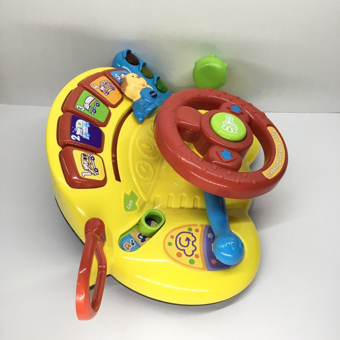 VTech Turn & Learn Driver Toy Steering Wheel (Category: Infant Playtime) located in Quezon City. Submitted by goodz4good (Listing ID 1450794899, Image 2). Description: - VTech Turn & Learn Driver toy - Lots of interactive buttons and sounds - Features a steering wheel, gear shifter, and traffic lights - Encourages motor skill development and learning about vehicles - Batteries not included mode of payment gcash cash or cod meet up available free 