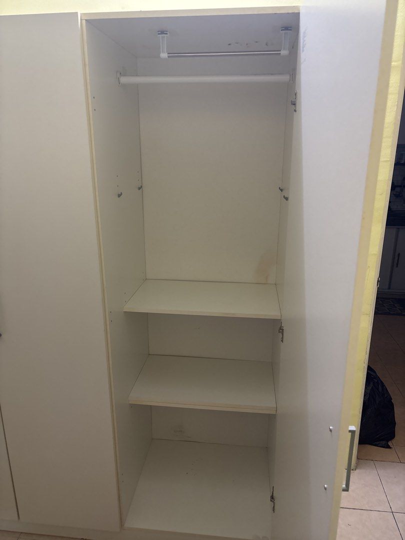 White 3-Door Wardrobe with Hanging Rail and Shelves (Category: Shelves, Cabinets & Racks) located in Cyberjaya. Submitted by fattahdollah (Listing ID 1450907148, Image 2). Description: - White 3-door wardrobe - Features a hanging rail and three shelves - Offers plenty of space for clothes and storage - Doors open and close smoothly - Minor marks inside (please check photos) -Kalau boleh self-pickup lagi baik, kalau tak boleh kena arrange lalamove