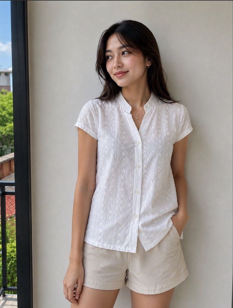 White Floral Eyelet Embroidered Blouse (Category: Blouses) located in Paranaque City. Submitted by hershop.sbt (Listing ID 1446538925, Image 3). Description: * Color: Beige * Style: Short-sleeve button-up blouse * Mandarin (band) collar * Front button closure * All-over floral eyelet embroidery * Soft front design * Lightweight and breathable fabric * Relaxed fit * Perfect for casual wear, office attire, or smart-casual occasions.