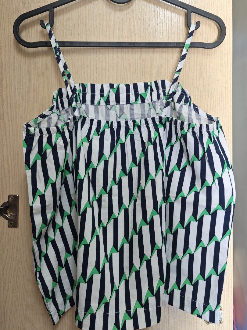 White, Navy, Green Geometric Print Spaghetti Strap Top (Category: Sleeveless) located in Taguig. Submitted by hellojuly (Listing ID 1450801506, Image 3). Description: - Cute spaghetti strap top with a stylish geometric print. - Features a flattering gathered neckline. - Made from lightweight and breathable fabric, ideal for comfort. - Versatile piece for casual outings or as a layering item. - Easily pairs with shorts or jeans for a complete look