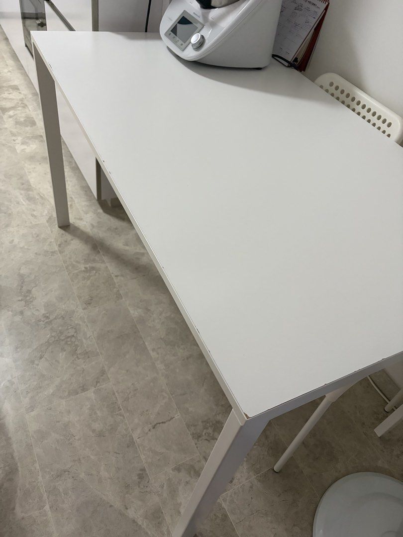 White Rectangular Dining Table (Category: Tables & Sets) located in Singapore. Submitted by tylertohky77465 (Listing ID 1450895087, Image 1). Description: IKEA table - White rectangular table - Versatile: suitable for dining or as a work desk - Features: Sturdy legs, easy-to-clean surface - Reason for selling: Moving house.