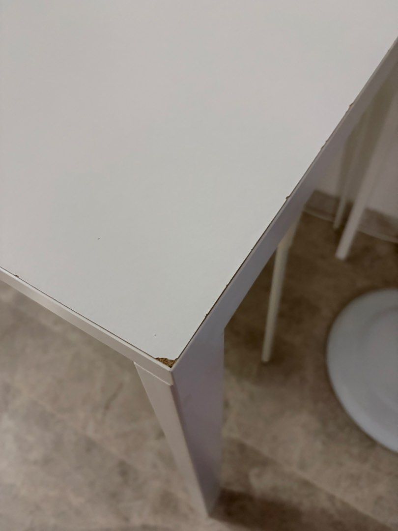 White Rectangular Dining Table (Category: Tables & Sets) located in Singapore. Submitted by tylertohky77465 (Listing ID 1450895087, Image 2). Description: IKEA table - White rectangular table - Versatile: suitable for dining or as a work desk - Features: Sturdy legs, easy-to-clean surface - Reason for selling: Moving house.