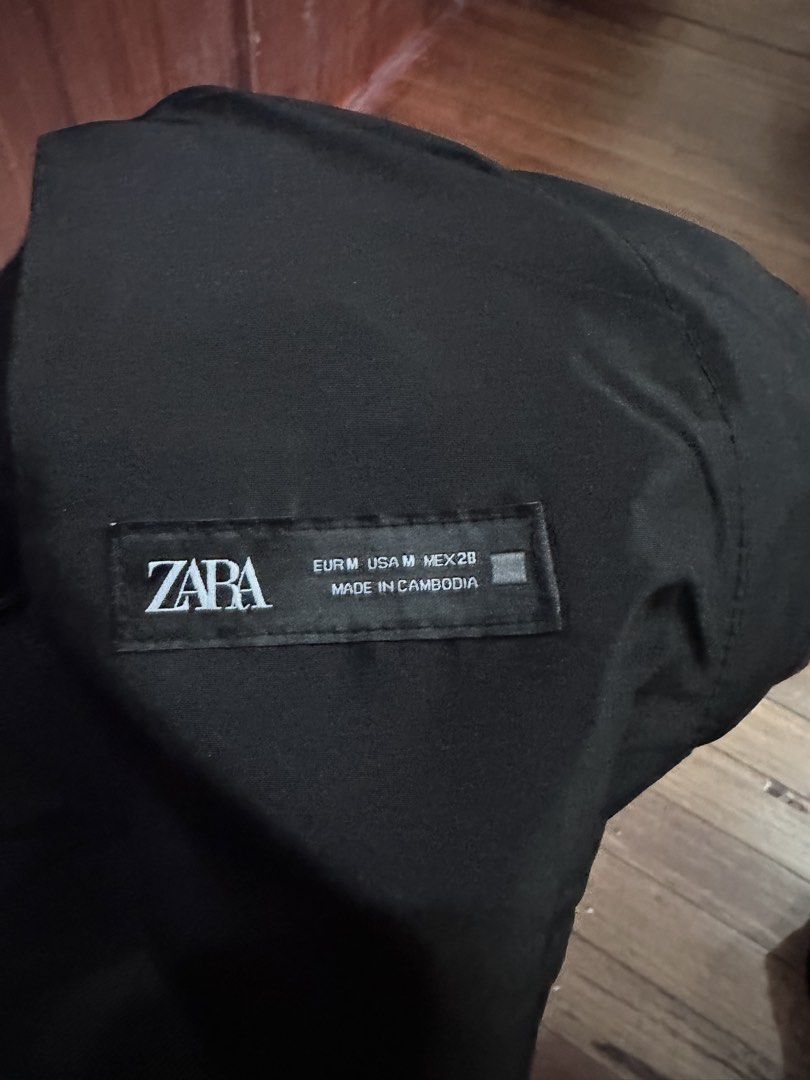 Zara Black Elastic Waist Pants Size M (Category: Other Bottoms) located in Davao. Submitted by fashiondeclutter11 (Listing ID 1450770208, Image 3). Description: - Zara black pants - Size: Medium - Elastic waistband with button closure - Two front pockets - Unique seam detail on legs - Made in Cambodia.
