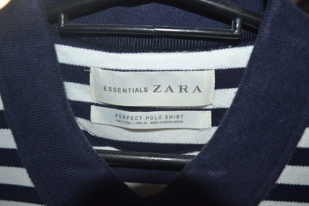 Zara Essentials Striped Polo Shirt (Category: Tshirts & Polo Shirts ) located in Valenzuela. Submitted by miss_merix (Listing ID 1450810087, Image 3). Description: - Classic navy and white striped polo shirt from Zara Essentials. - Short sleeves with ribbed collar and cuffs. - Button-up placket at the neck. - Small embroidered logo on the chest. - Comfortable cotton blend fabric. - Ideal for casual everyday wear..