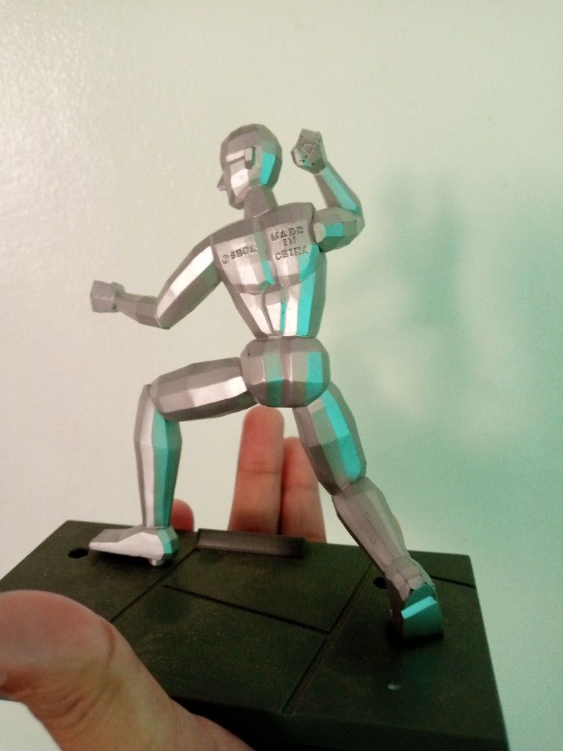 1993 Sega Virtua Fighter Silver Figure Model "Dural" on Base (Category: Figurines & Statues) located in General Trias. Submitted by dwyane09 (Listing ID 1450957766, Image 2). Description: - Silver figure model - Includes dark base with 'Dural' label - Movable joints for versatile posing - Ideal for artists and collectors - Made in China - Some text present on the back of the figure.