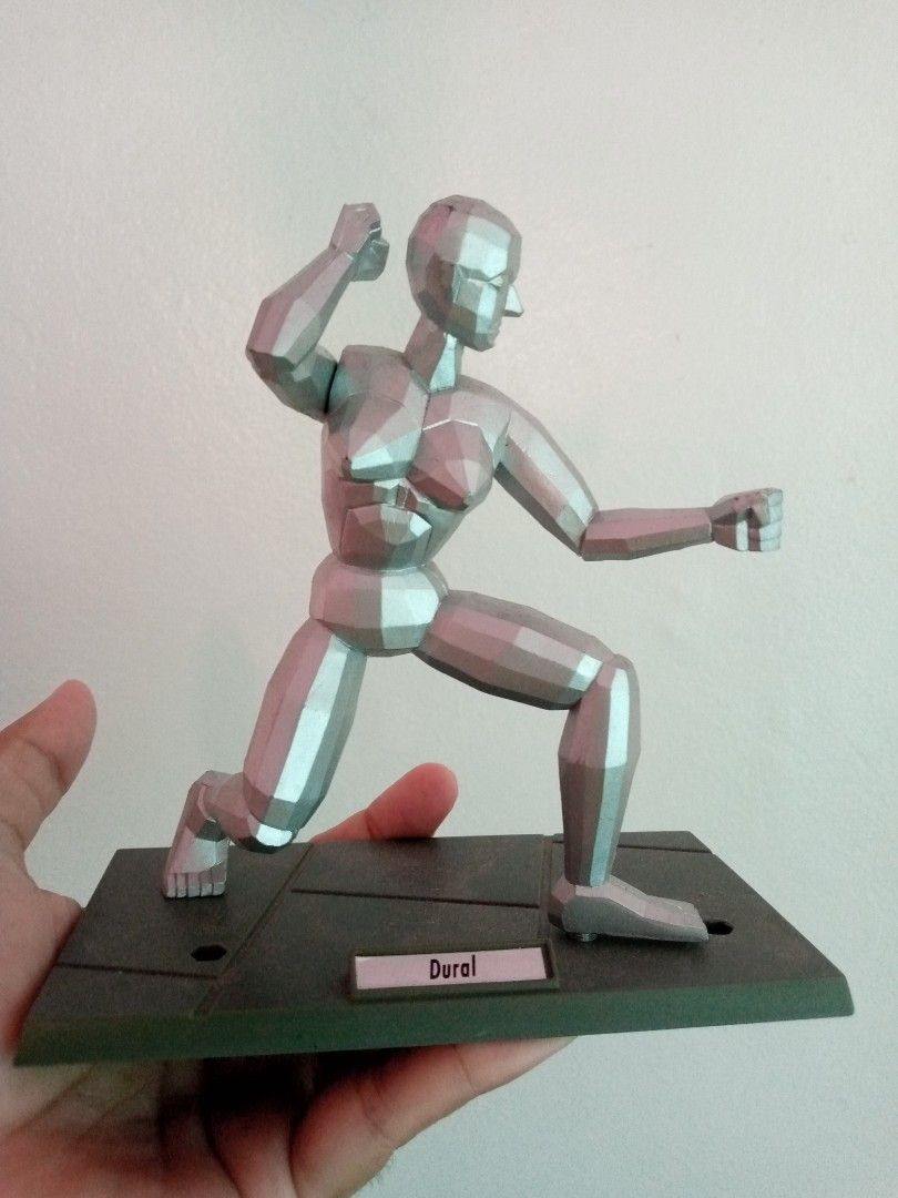 1993 Sega Virtua Fighter Silver Figure Model "Dural" on Base (Category: Figurines & Statues) located in General Trias. Submitted by dwyane09 (Listing ID 1450957766, Image 1). Description: - Silver figure model - Includes dark base with 'Dural' label - Movable joints for versatile posing - Ideal for artists and collectors - Made in China - Some text present on the back of the figure.