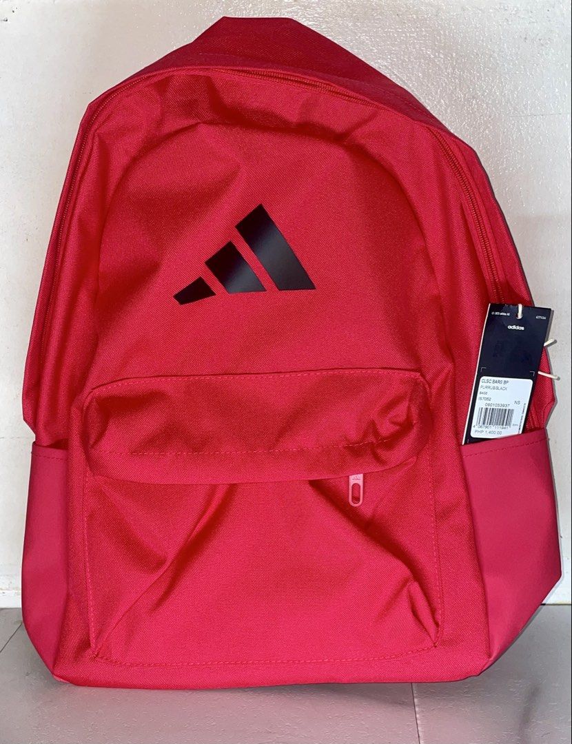 Adidas CLSC BARS BP Backpack - Red, Purple and Light blue (Category: Backpacks) located in Quezon City. Submitted by john_b17 (Listing ID 1451093107, Image 1). Description: - Classic red Adidas backpack - Iconic three-bar logo on the front - Front zippered pocket - Side pockets - Padded shoulder straps for comfort - Brand new with tags attached - Ideal for school, gym, or everyday use.