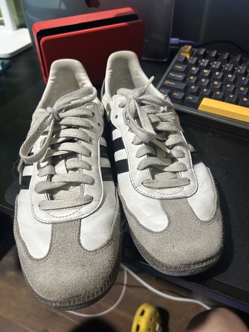 Adidas Samba OG White Black Leather Sneakers (Category: Sneakers) located in Quezon City. Submitted by dicgrayson (Listing ID 1451007889, Image 2). Description: - Classic Adidas Samba OG sneakers - White leather with black stripes - Grey suede toe cap - Perfect for casual wear - Shows some signs of wear, but plenty of life left - Iconic and stylish kicks.