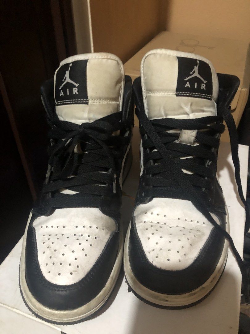 Air Jordan 1 Mid Black White Sneakers (Category: Sneakers) located in Quezon City. Submitted by markupapparel (Listing ID 1451070254, Image 2). Description: - Authentic Air Jordan 1 Mid sneakers - Classic black and white colorway - Mid-top silhouette - Black laces - Size: 6 (US Women's) - Includes original box.