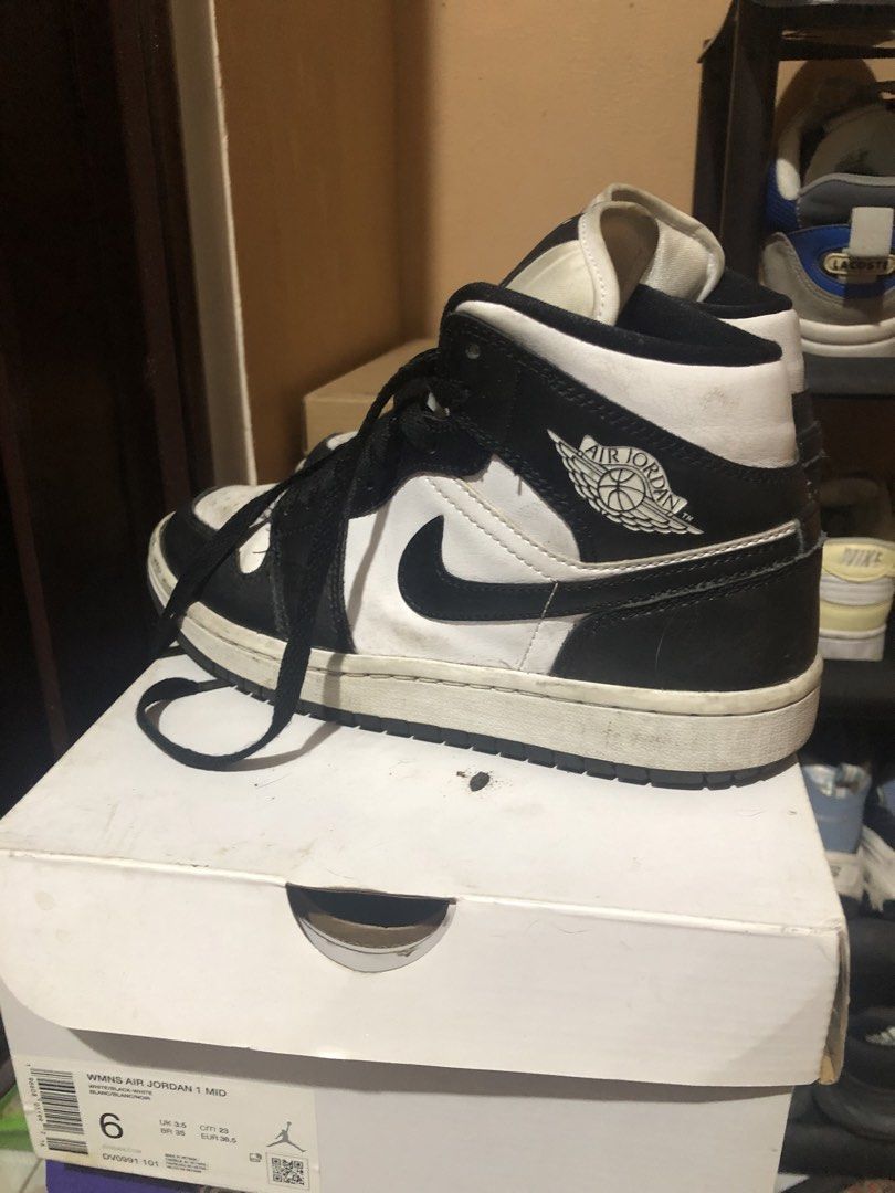 Air Jordan 1 Mid Black White Sneakers (Category: Sneakers) located in Quezon City. Submitted by markupapparel (Listing ID 1451070254, Image 1). Description: - Authentic Air Jordan 1 Mid sneakers - Classic black and white colorway - Mid-top silhouette - Black laces - Size: 6 (US Women's) - Includes original box.