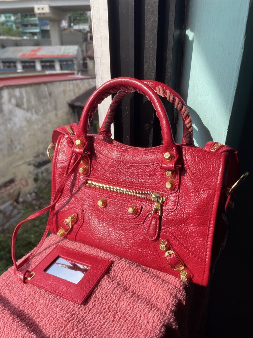 Balenciaga mini city in red (Category: Luxury Bags & Wallets) located in Alegria. Submitted by deniseeee.21 (Listing ID 1451023485, Image 2). Description: Self authenticate Flaws on pic Rank S.