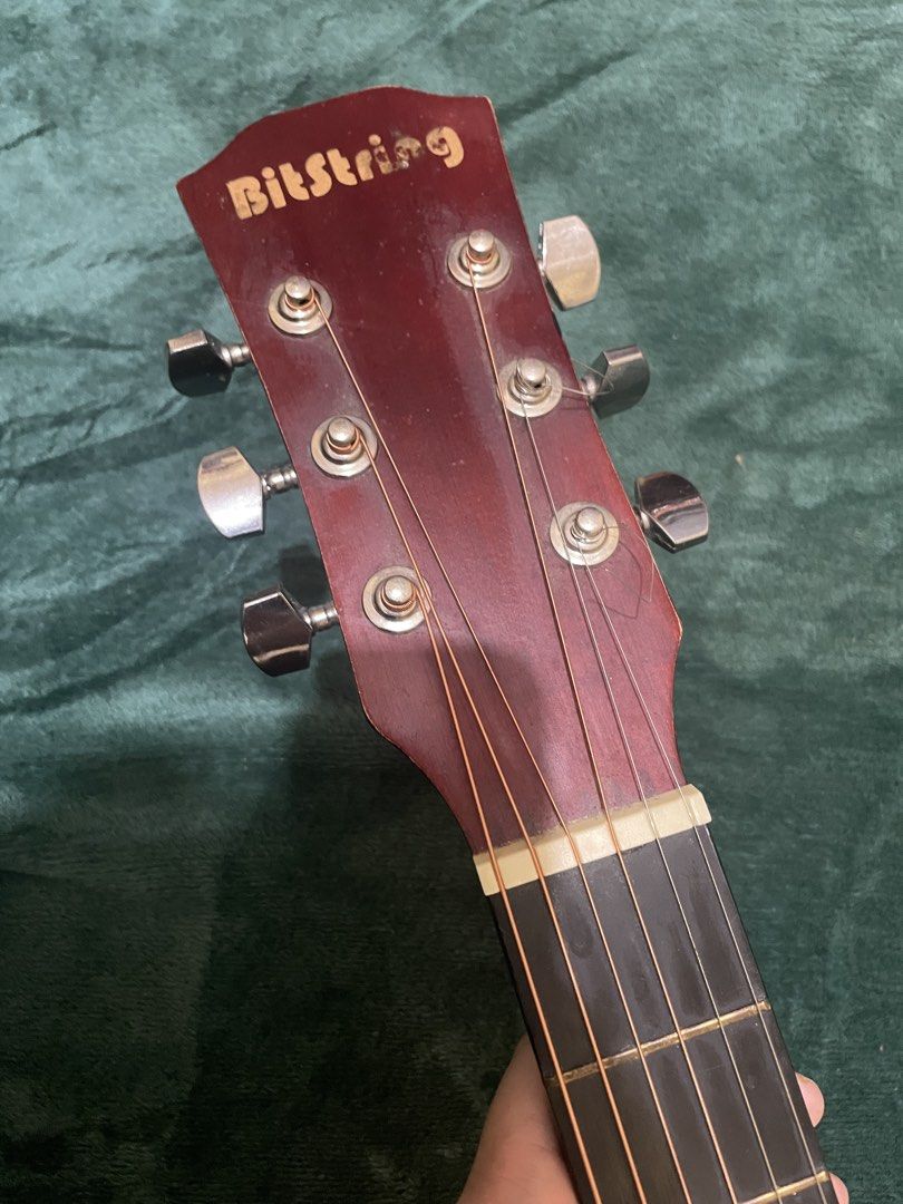 Bitstring Acoustic Guitar - Natural Wood Finish (Category: Musical Instruments) located in Mabalacat. Submitted by mnaniii (Listing ID 1451052583, Image 3). Description: - Bitstring acoustic guitar - Natural wood top with red stained back and sides - Cutaway body style - 6 strings - Ideal for beginners or reliable everyday playing - Tuners located on the headstock - Ready for strumming and immediate use Delivery Can do meetup around bulacan .