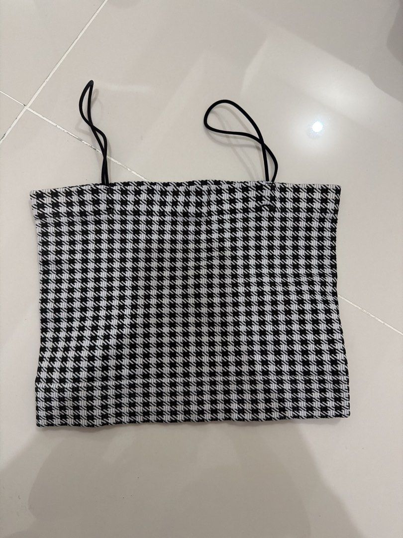 Black and White Gingham Spaghetti Strap Crop Top (Category: Sleeveless) located in Cavite. Submitted by thingsidontuse (Listing ID 1451082130, Image 1). Description: - Adorable gingham print crop top - Features comfortable spaghetti straps - Made with a stretchy fabric for a great fit - Versatile for casual outings or dressing up - Effortlessly pairs with jeans, skirts, and more - A simple yet stylish addition to your wardrobe.