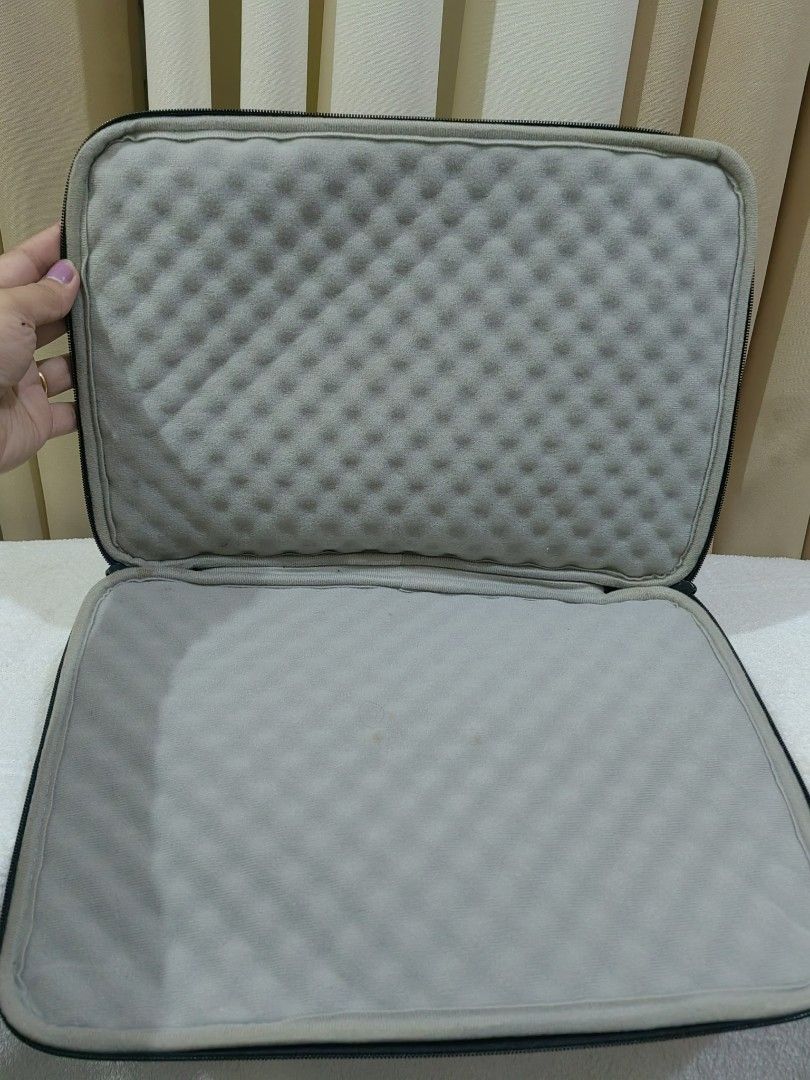 Black Laptop Sleeve Pouch Bag (Category: Laptop Bags & Sleeves) located in Makati City. Submitted by prelovedtreatedwithlove (Listing ID 1451066026, Image 2). Description: - Black laptop sleeve - Padded interior for protection - Front zip pocket for accessories - Soft, quilted lining - Fits most standard laptops - Secure zip closure - Perfect for travel or daily commute -no issue -13 inches - A042.