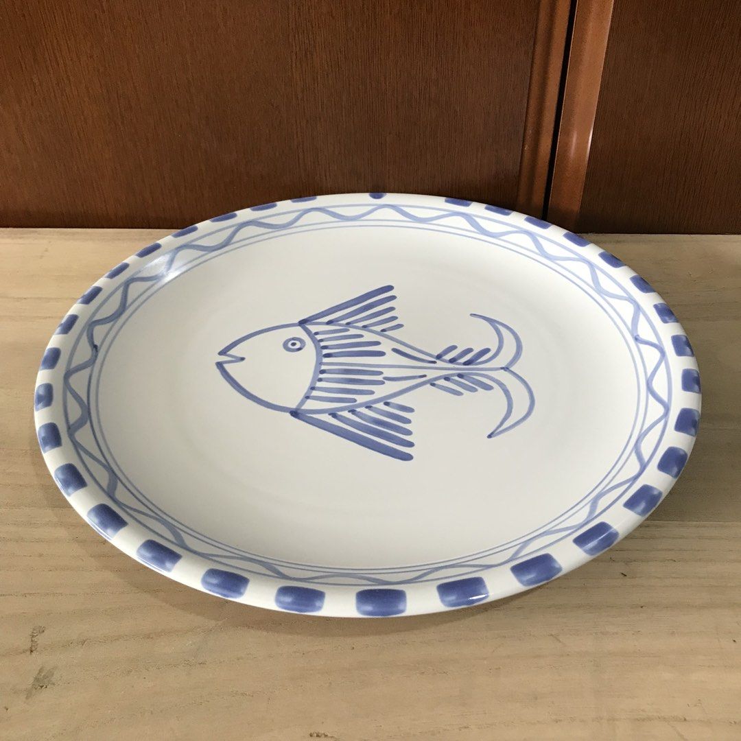 Blue Fish Ceramic Plate Decorative Serving Dish (Category: Dinnerware & Cutlery) located in Baao. Submitted by all.things.japan (Listing ID 1451016753, Image 2). Description: - 12.75 x 1.0 inches - 4 pcs. Available -P340.00 per piece - White ceramic plate - Features a charming blue fish design - Decorative border with blue patterns - Approximately 10 inches in diameter - Perfect for serving food or as a decorative display piece - Adds a lovely na