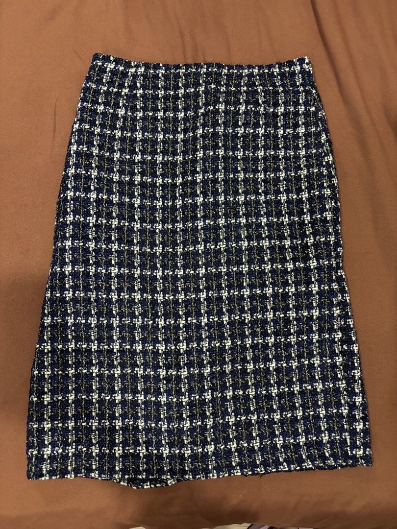 Blue Plaid Tweed Midi Skirt (Category: Skirts) located in Manila. Submitted by laijane (Listing ID 1450951709, Image 2). Description: - Classic blue plaid tweed midi skirt - Textured weave with blue, white, and metallic threads - Straight cut with a front slit - Versatile for dressing up or down Waist 30 cm Hips 34 cm Length 32 cm .