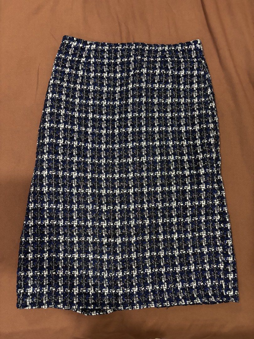 Blue Plaid Tweed Midi Skirt (Category: Skirts) located in Manila. Submitted by laijane (Listing ID 1450951709, Image 1). Description: - Classic blue plaid tweed midi skirt - Textured weave with blue, white, and metallic threads - Straight cut with a front slit - Versatile for dressing up or down Waist 30 cm Hips 34 cm Length 32 cm .