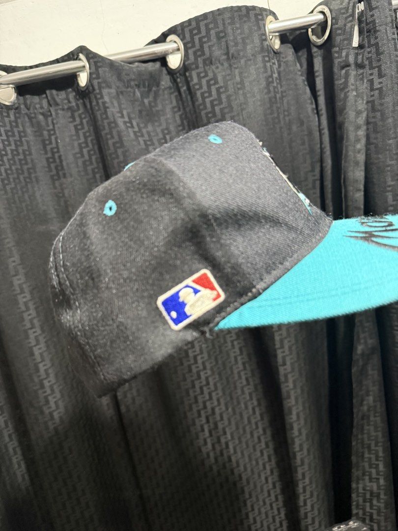 BRIM script Florida Marlins Sports Specialties Snapback Hat (Category: Caps & Hats) located in Pasay City. Submitted by lenesiesph08647 (Listing ID 1451010571, Image 3). Description: - Vintage Florida Marlins hat - Black with teal brim and logo - Features the Marlins script on the front - Made by Sports Specialties - One size fits all snapback style - Perfect for any Marlins fan!.