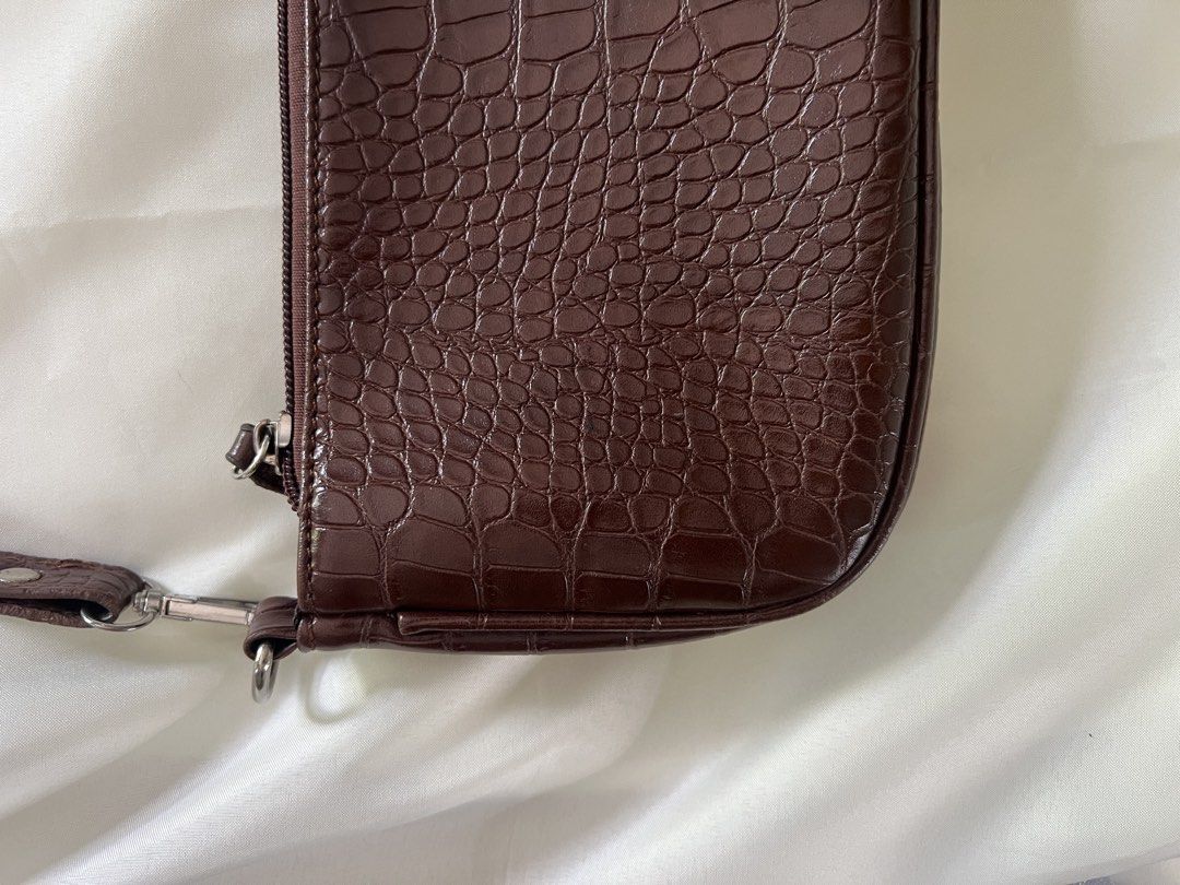 Brown Croc Embossed Shoulder Bag (Category: Shoulder Bags) located in Dasmarinas. Submitted by nadui (Listing ID 1450969593, Image 2). Description: Cute brown shoulder bag with a croc embossed texture. Zipper closure. Has a small inner zip pocket. Silver hardware details. Great for everyday use. Fits essentials. *️⃣ MOP: Gcash, Bank Transfer .