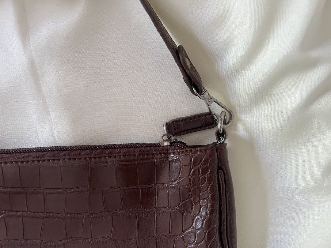 Brown Croc Embossed Shoulder Bag (Category: Shoulder Bags) located in Dasmarinas. Submitted by nadui (Listing ID 1450969593, Image 3). Description: Cute brown shoulder bag with a croc embossed texture. Zipper closure. Has a small inner zip pocket. Silver hardware details. Great for everyday use. Fits essentials. *️⃣ MOP: Gcash, Bank Transfer .