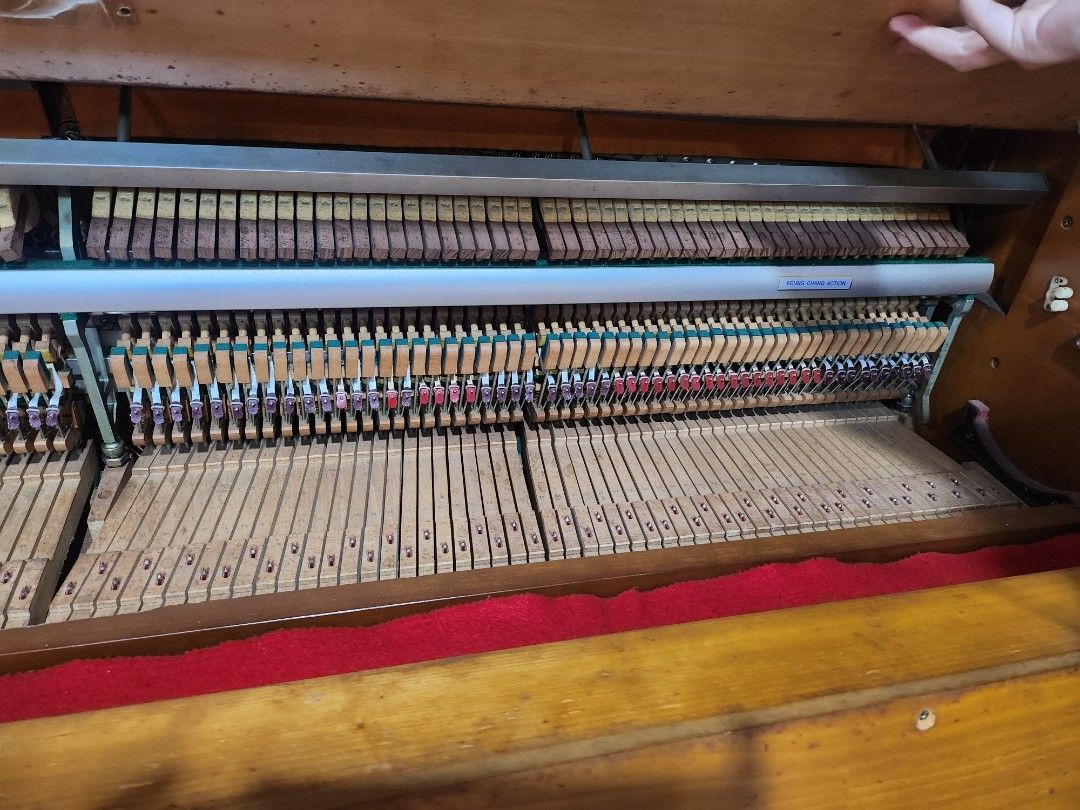 Brown Upright Piano with Bench (Category: Musical Instruments) located in Pasig City. Submitted by swifttiger_9ce6a2 (Listing ID 1451054788, Image 3). Description: - Elegant upright piano with a classic wooden finish. - Comes with a charming pink quilted bench. - Keys and internal mechanism clearly visible in photos. - Ideal for piano practice or as a stylish display item. - Buyer must arrange for pickup. - korea best brand 'youngchang'.