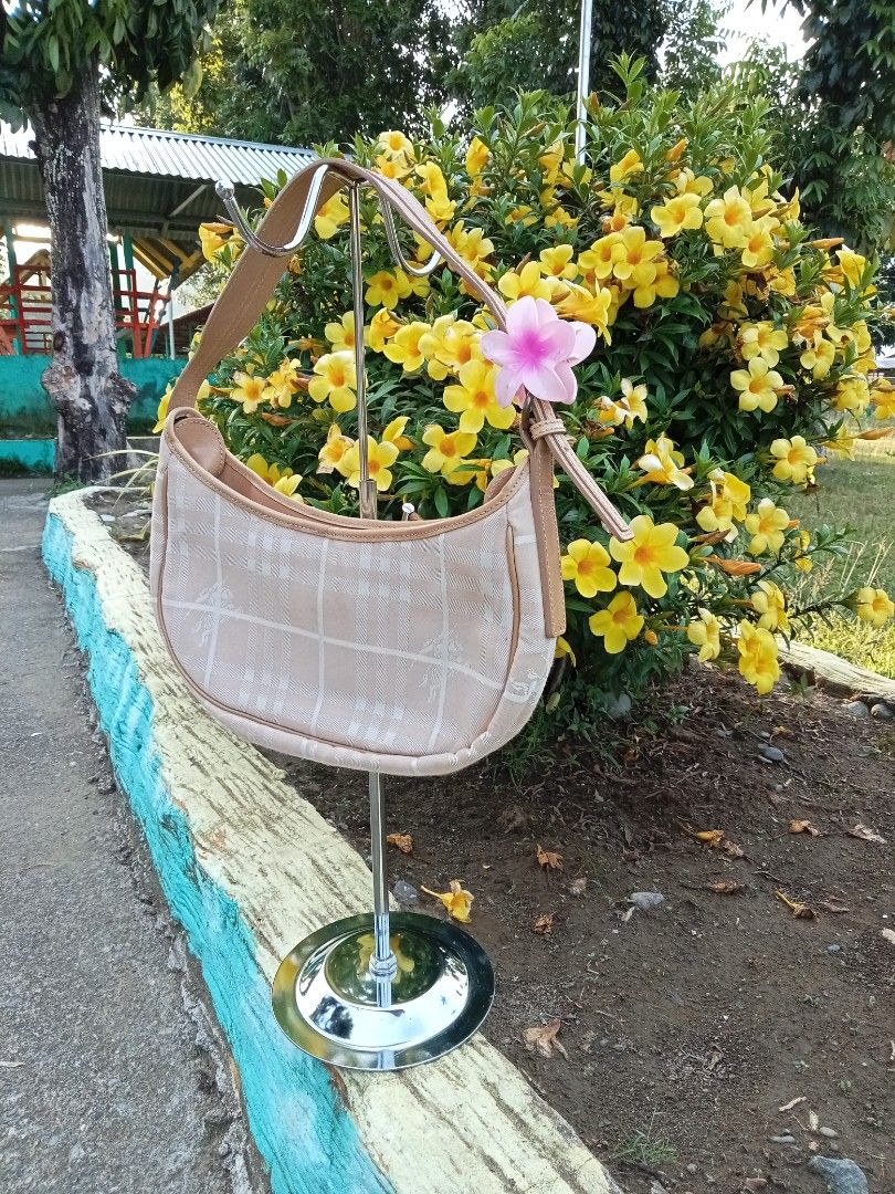 Burberry pink canvass hobo bag (Category: Luxury Bags & Wallets) located in Bagabag. Submitted by thrift_stories96 (Listing ID 1451045068, Image 3). Description: Burberry canvass pink hobo bag Small size rare color 4 compartments inside 3 small size and main compartment Kasya long wallets,and any size of cp Measurements Height - 6.5 inches Width - 11.5 inches Clean interior and exterior Normal sign of use No major flaws.