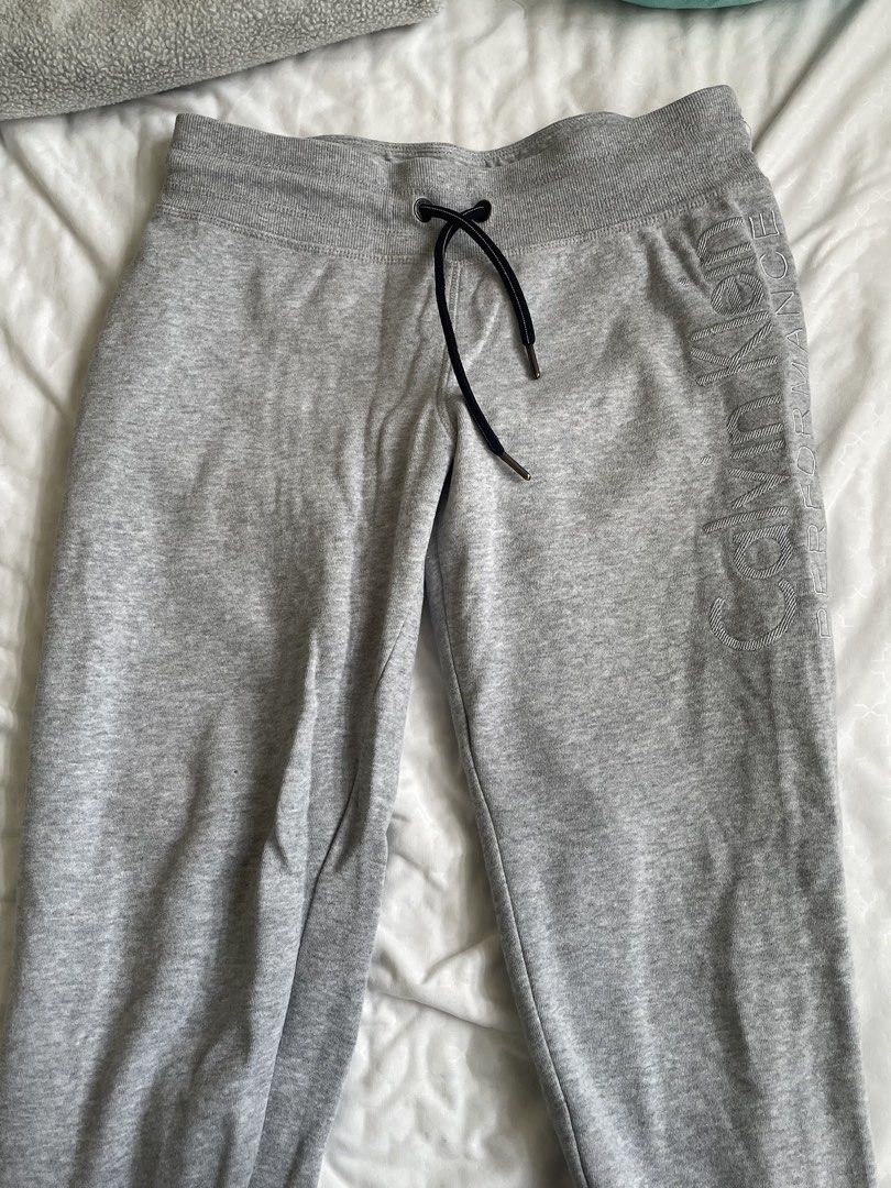 Calvin Klein Performance Grey Logo Sweatpants Size M (Category: Activewear) located in Las Pinas. Submitted by serialthrifter (Listing ID 1450971864, Image 1). Description: - Grey Calvin Klein Performance sweatpants - Embossed Calvin Klein logo down the side of the leg - Elastic waistband with adjustable drawstring - Ribbed cuffs for a snug fit - Comfortable cotton and polyester blend - Ideal for lounging, casual wear, or workouts Length: 34 in P