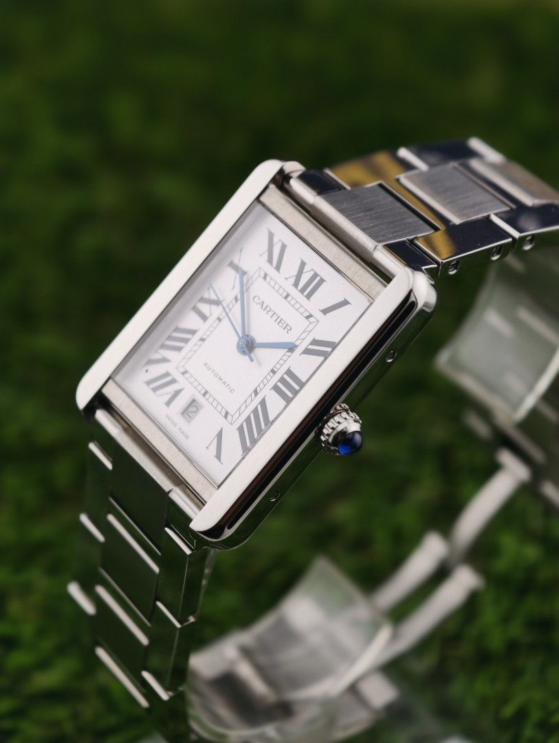 Cartier Tank Automatic Stainless Steel Watch (Category: Luxury Watches) located in Muntinlupa City. Submitted by watch.hunter.ph (Listing ID 1451083190, Image 2). Description: - Authentic Cartier Tank Watch - Stainless Steel Case & Bracelet - White Dial with Roman Numerals - Automatic Movement with Date Display - Includes Original Cartier Box - Versatile for Everyday or Special Occasions - Complete set.