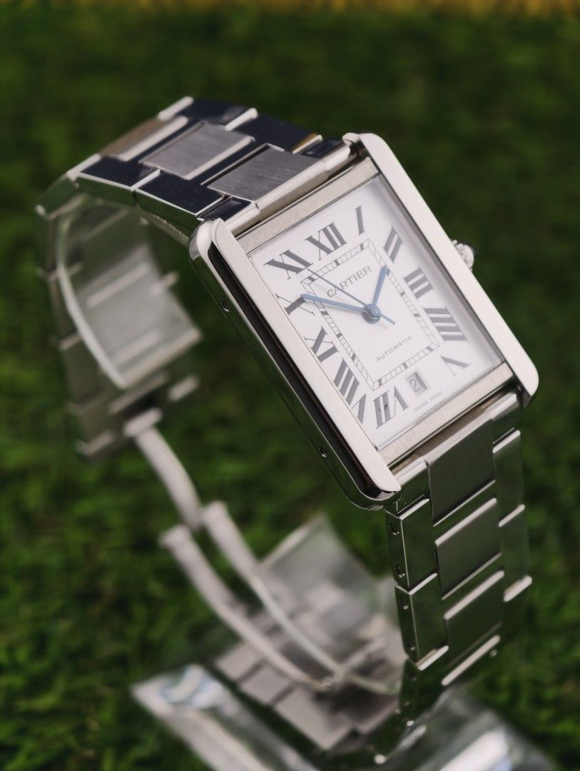 Cartier Tank Automatic Stainless Steel Watch (Category: Luxury Watches) located in Muntinlupa City. Submitted by watch.hunter.ph (Listing ID 1451083190, Image 3). Description: - Authentic Cartier Tank Watch - Stainless Steel Case & Bracelet - White Dial with Roman Numerals - Automatic Movement with Date Display - Includes Original Cartier Box - Versatile for Everyday or Special Occasions - Complete set.