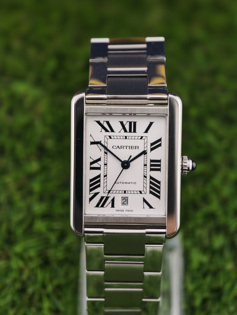 Cartier Tank Automatic Stainless Steel Watch (Category: Luxury Watches) located in Muntinlupa City. Submitted by watch.hunter.ph (Listing ID 1451083190, Image 1). Description: - Authentic Cartier Tank Watch - Stainless Steel Case & Bracelet - White Dial with Roman Numerals - Automatic Movement with Date Display - Includes Original Cartier Box - Versatile for Everyday or Special Occasions - Complete set.