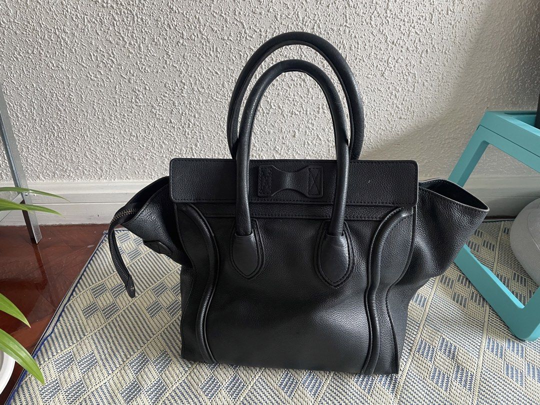 Celine Luggage Tote Bag Black (Category: Luxury Bags & Wallets) located in Makati City. Submitted by goodjujugoods (Listing ID 1450971068, Image 3). Description: black grainy leather signature structured wings and a front zipper pocket comes with original celine dust bag .