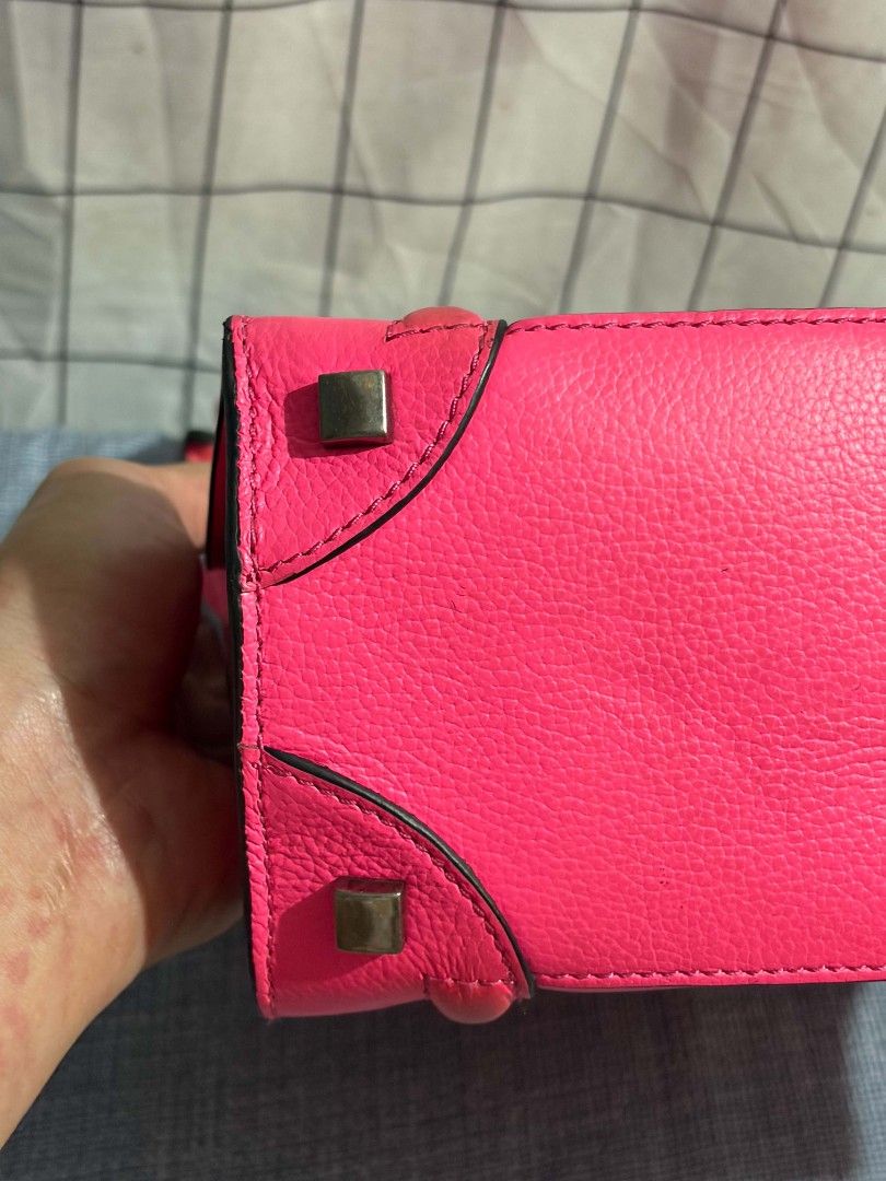 Celine Neon Pink Leather Top Handle Bag (Category: Luxury Bags & Wallets) located in Manila. Submitted by preciousma24494 (Listing ID 1451052595, Image 3). Description: - Eye-catching neon pink Celine bag - Made in Italy craftsmanship - Genuine leather exterior - Interior zippered compartments for organization - Convenient front zip pocket - Stylish metal hardware details on corners - Comfortable top handles for carrying - Perfect statement acces
